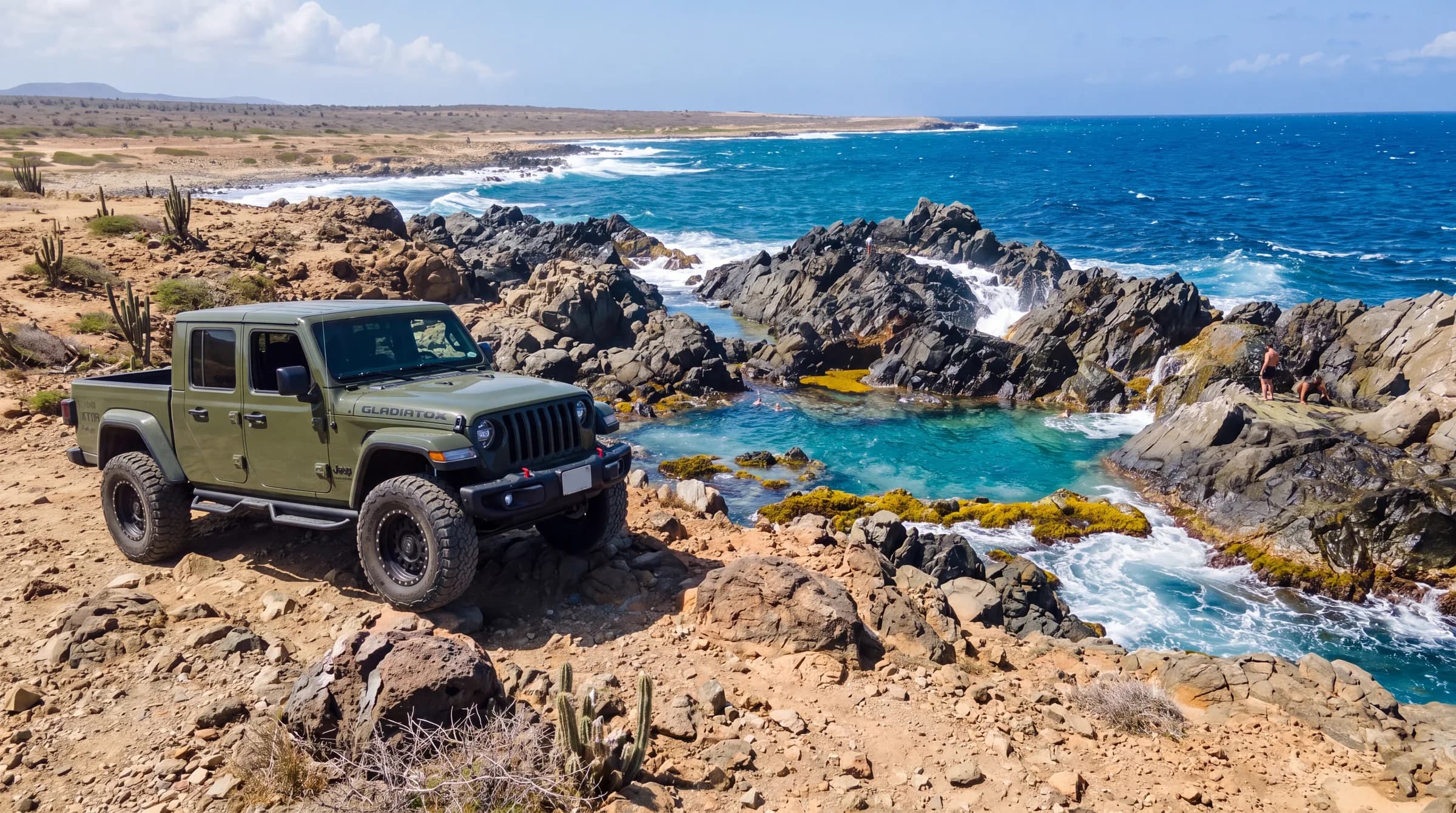 A Jeep parked at the viewpoint above Conchi, the Natural Pool, on the Aruba north coast